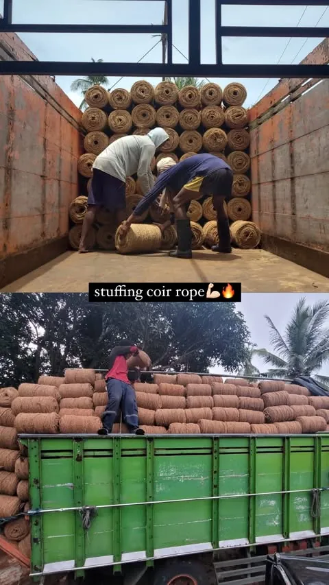 Workers loading coir rope coils into a truck